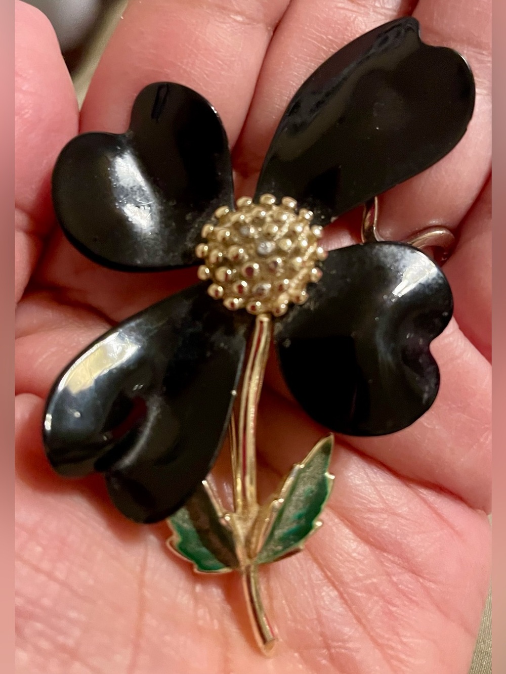 Sarah Coventry Black Enamel Flower Brooch with Gold Center and Green Leaves